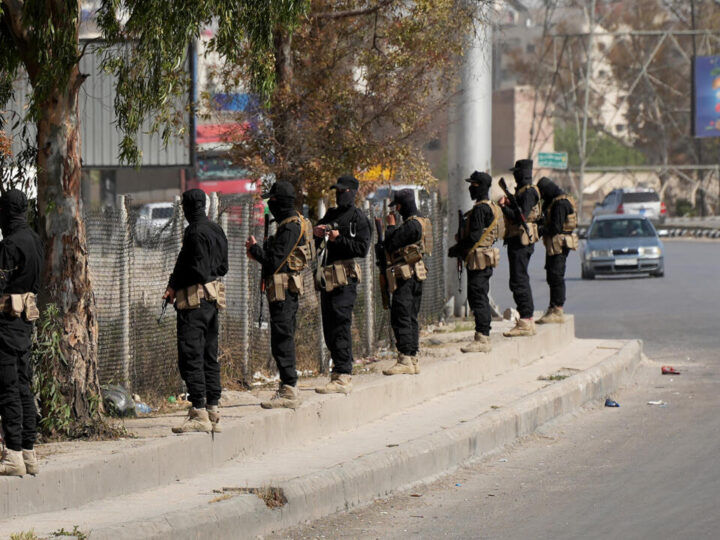 A Druze Shooter and Syrian Security officers are Deployed in a Suburb of Damascus
