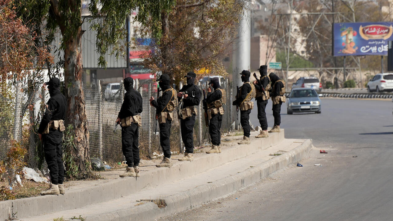 A Druze Shooter and Syrian Security officers are Deployed in a Suburb of Damascus